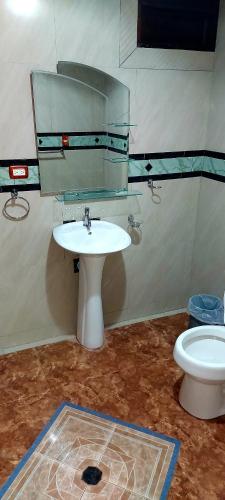 a bathroom with a sink and a toilet at El Castillo Monte Campana in Puntarenas