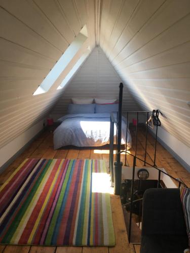 Ένα ή περισσότερα κρεβάτια σε δωμάτιο στο Heatherbell Cottage Guest Accommodation
