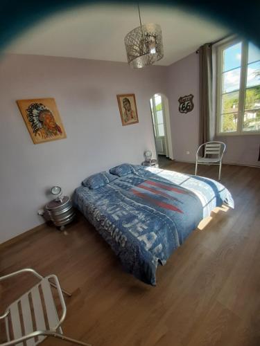 Ένα ή περισσότερα κρεβάτια σε δωμάτιο στο Le Clos de la Salamandre