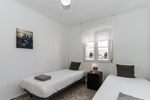 Postel nebo postele na pokoji v ubytování Andaluz Apartments - Algarrobo