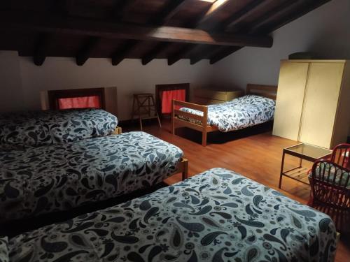 Säng eller sängar i ett rum på La corte del pane