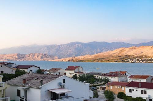 a town with a view of the water and mountains at MB Bed&Breakfast in Pag