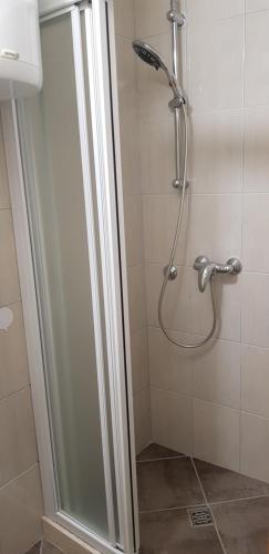 a shower with a glass door in a bathroom at Antea in Split