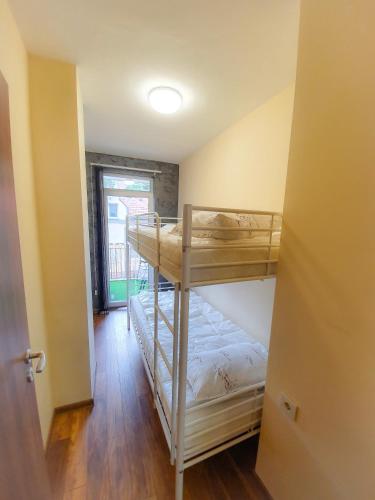 a bedroom with two bunk beds in a room at Malavi DV2 top center apartment Ruse in Ruse