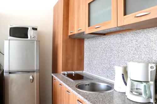 a small kitchen with a sink and a refrigerator at BEACH APARTMENT no 17 in St. St. Constantine and Helena