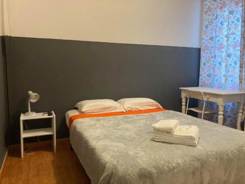 Ένα ή περισσότερα κρεβάτια σε δωμάτιο στο Peters Guesthouse