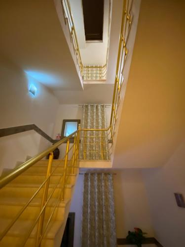 a set of stairs in a room with a stair case at Guesthouse Liamra in Ulcinj