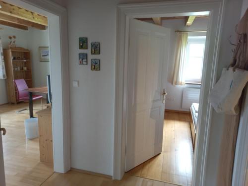 an open door in a room with a table at Attersee Gartenvilla in Nussdorf am Attersee