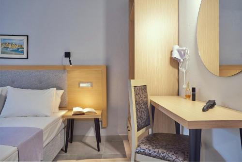 Ένα ή περισσότερα κρεβάτια σε δωμάτιο στο Sergiani Garden Hotel Apartments