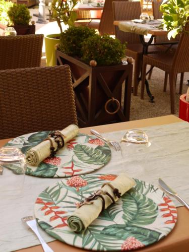 a table with a plate of food on it at Le Chapeau Rouge in Lusignan