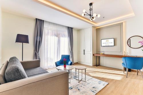 a living room with a couch and a table at Boutique Hotel Momentum by Aycon in Budva