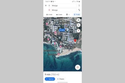 a screenshot of a cell phone with a google maps page at Un appartement de charme à Hammamet in Hammamet