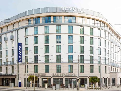 a large white building with a sign on it at Novotel Nuernberg Centre Ville in Nuremberg