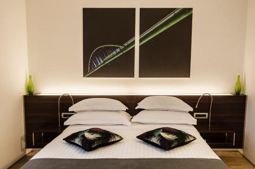 Een bed of bedden in een kamer bij Hotel Jarun