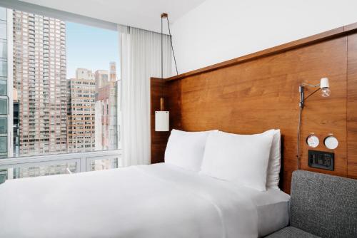 Una cama o camas en una habitación de Arlo NoMad