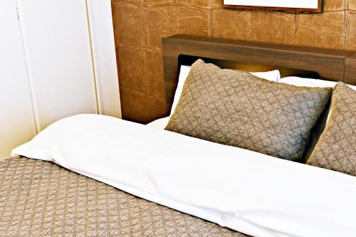 Кровать или кровати в номере だるまマンション 902