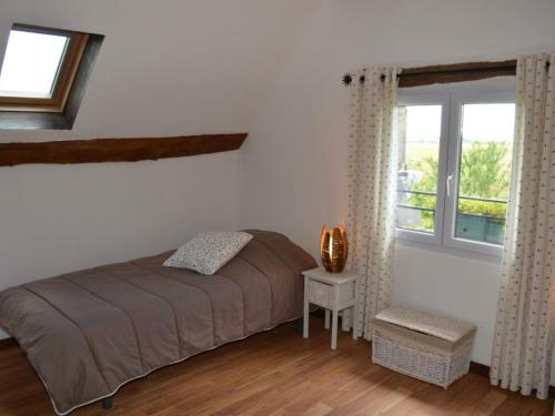 Tempat tidur dalam kamar di Gîte Nazelles-Négron, 3 pièces, 4 personnes - FR-1-381-201