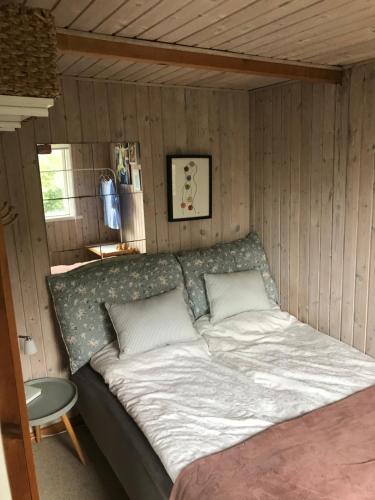 a bedroom with a large bed in a room at The Beach House in Haderslev