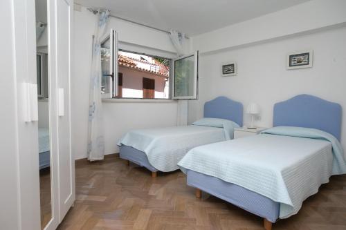 Ένα ή περισσότερα κρεβάτια σε δωμάτιο στο N143 - Numana, bellissimo trilocale a 100mt dal mare