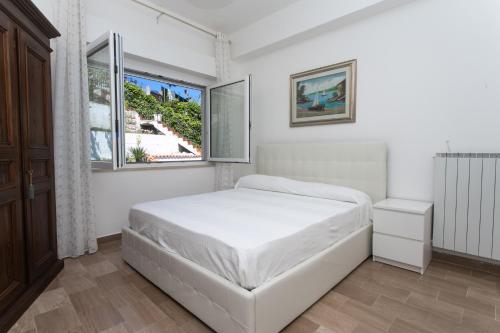 Ένα ή περισσότερα κρεβάτια σε δωμάτιο στο N144 - Numana, comodo quadrilocale a 100mt dal mare