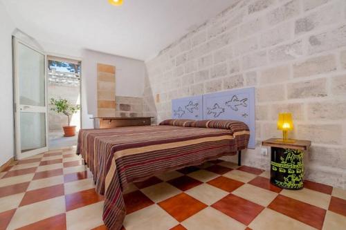 Giường trong phòng chung tại Villa Odetta - appartamento Limonaia