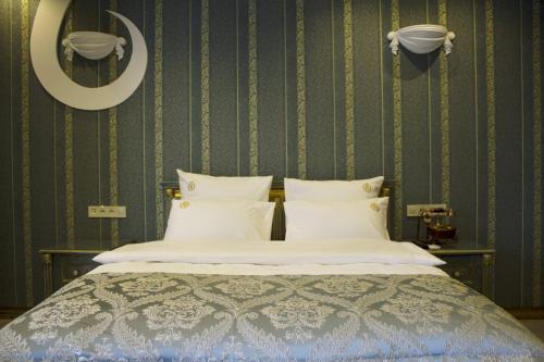 Ένα ή περισσότερα κρεβάτια σε δωμάτιο στο Neapol Boutique Hotel