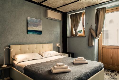 Ліжко або ліжка в номері Giulia camere