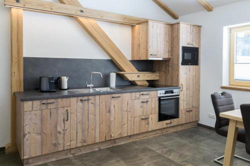 Kuchyň nebo kuchyňský kout v ubytování Apartments Edinger