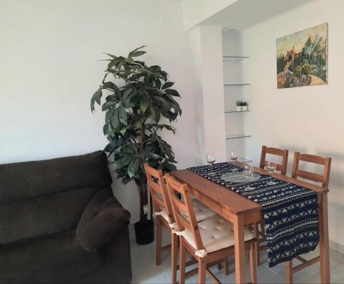 a living room with a table and a couch at Wanderlust Apartment Old Town in Tarragona