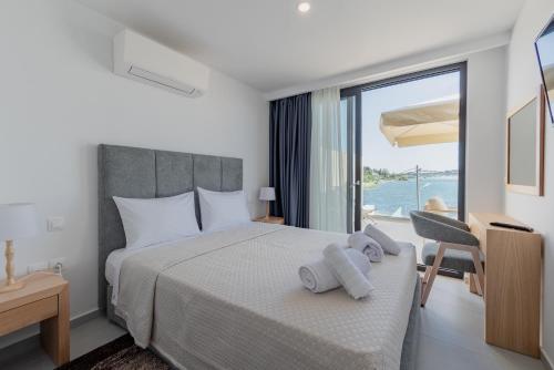 Ένα ή περισσότερα κρεβάτια σε δωμάτιο στο Swans Luxury Homes