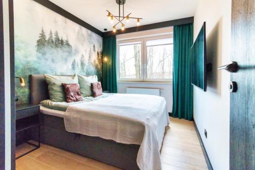 Postel nebo postele na pokoji v ubytování Annapurna Apartamenty Szklarska Poręba