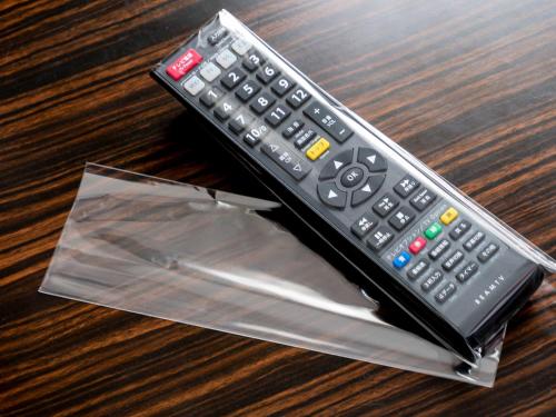 a remote control sitting on top of a table at APA Hotel Akasaka Mitsuke in Tokyo