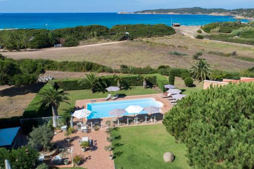 an aerial view of a resort with a swimming pool at Hôtel Les Lentisques in Cargèse