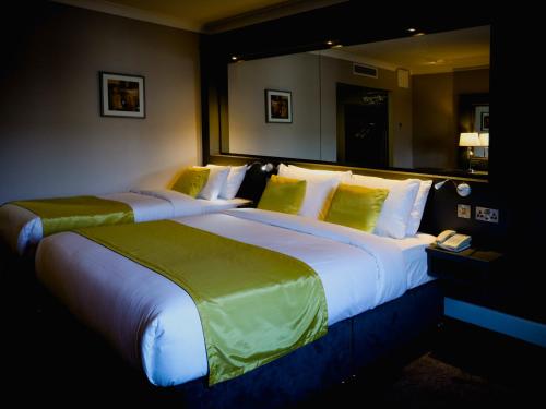 two large beds in a hotel room at Claregalway Hotel in Claregalway