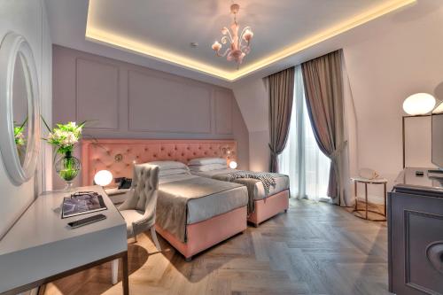A bed or beds in a room at Hotel Premiere Abano