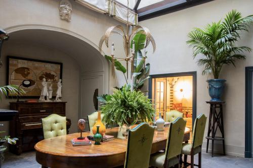 a dining room with a wooden table and chairs at The Place Firenze in Florence