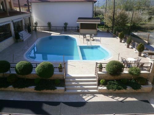 an overhead view of a swimming pool in a yard at 4 Epoxes Hotel Spa in Kato Loutraki