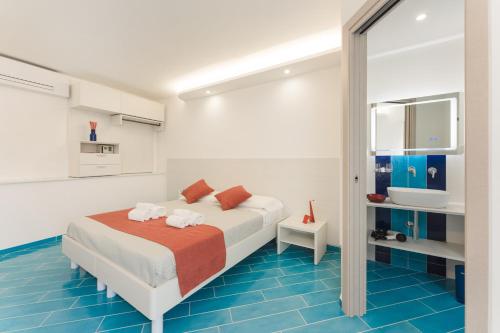 Кровать или кровати в номере Corallo Residence