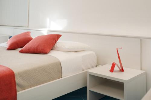 Postel nebo postele na pokoji v ubytování Il Corallo Residence