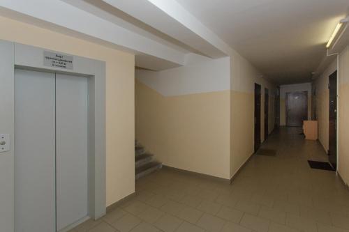 an empty hallway with stairs in a building at СВЕЖО! Basic - Студия У Озера На Бурнаковской in Nizhny Novgorod