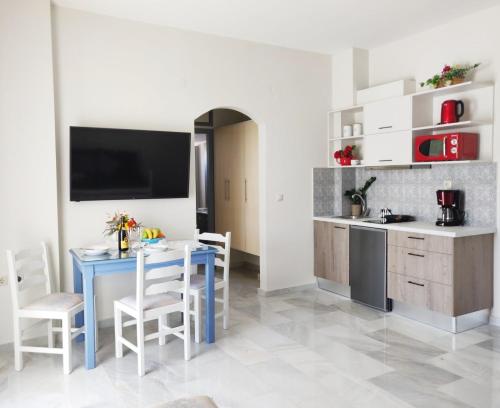 A kitchen or kitchenette at Emorfia's Apartments