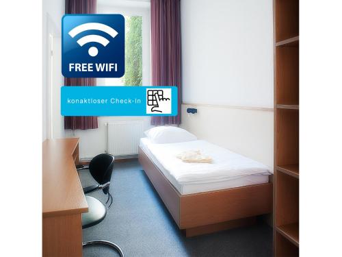 Un ou plusieurs lits dans un hébergement de l'établissement Steps-Hotel