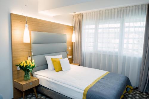 Hotel Vivaldi tesisinde bir odada yatak veya yataklar