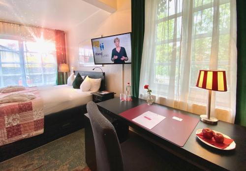 TV a/nebo společenská místnost v ubytování Lilis kleines Hotel