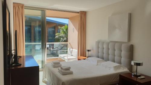 Postel nebo postele na pokoji v ubytování Apartamento Salgados Beach