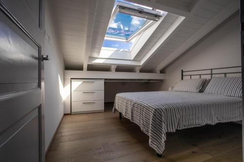 En eller flere senge i et værelse på La Dimora del Glicine