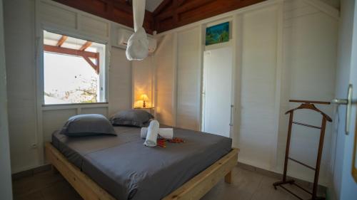 Ένα ή περισσότερα κρεβάτια σε δωμάτιο στο KALINAGO - Les Villas KIKKO