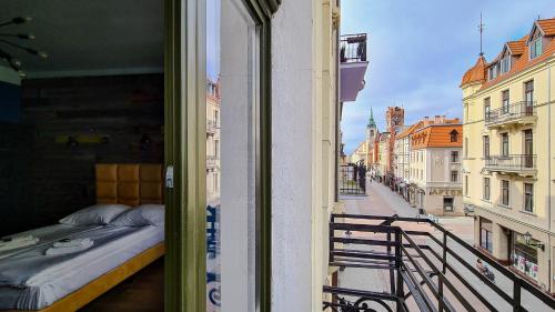 Postel nebo postele na pokoji v ubytování Apartamenty Szeroka 23