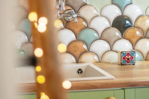 a kitchen counter with a bunch of eggs on a shelf at Gorgona Blue Apartments in Karpathos Town