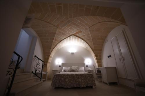 Ένα ή περισσότερα κρεβάτια σε δωμάτιο στο PLAZACARRISI HOTEL & SPA